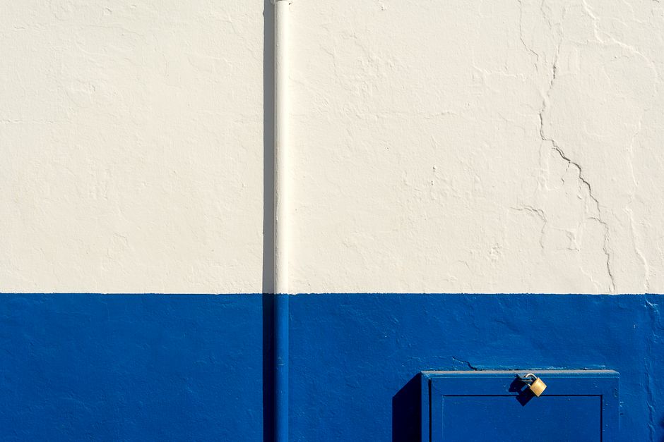 Painted house wall with a window and trim