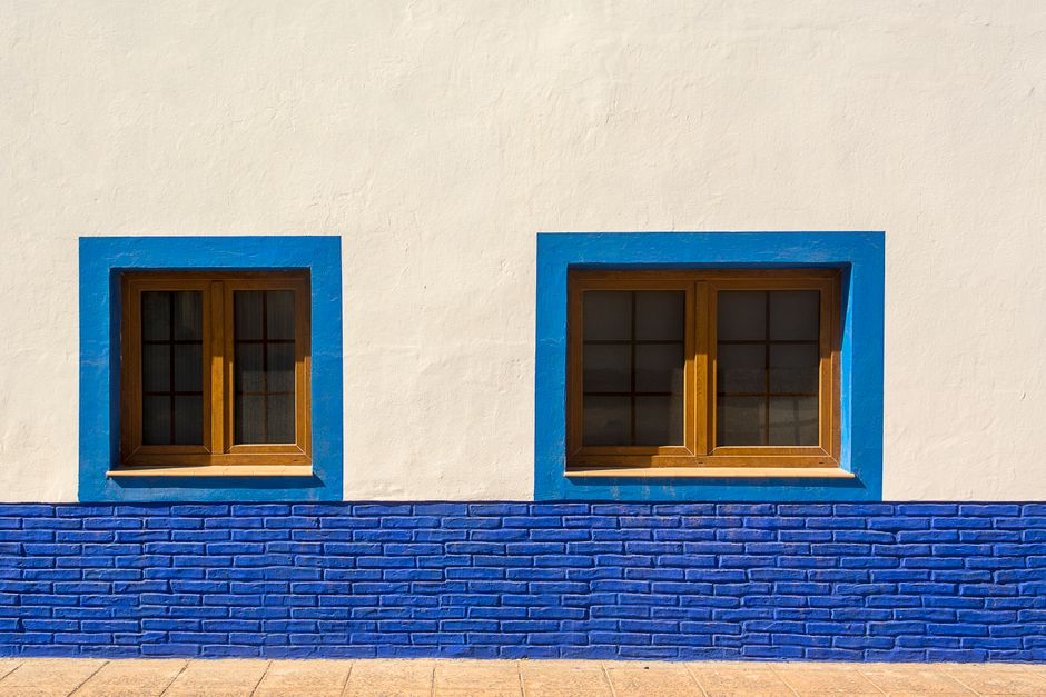 Wooden shutters on a painted exterior wall