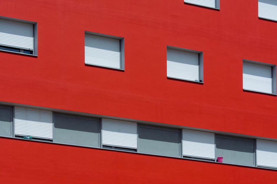 Wooden shutters on a painted exterior wall